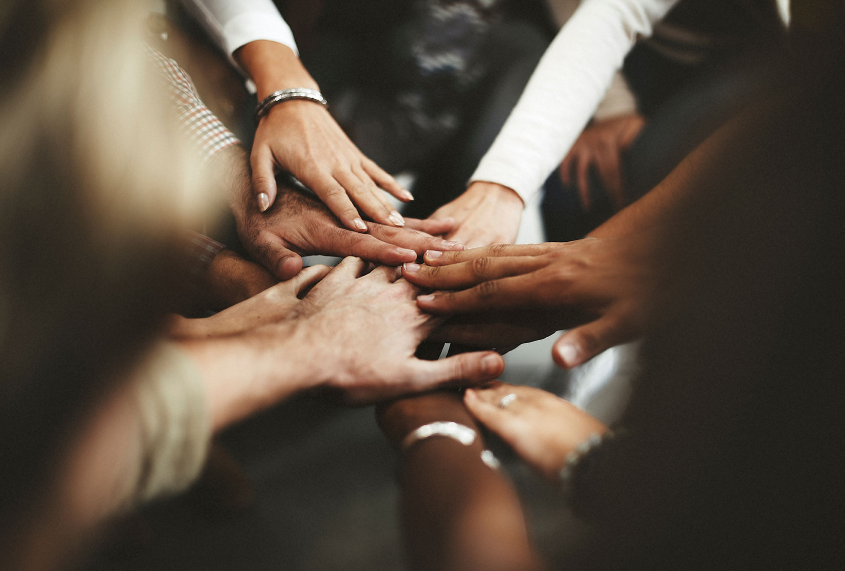 https://www.synergio.co.uk/images/uploads/Diverse-Hands-Together.jpg